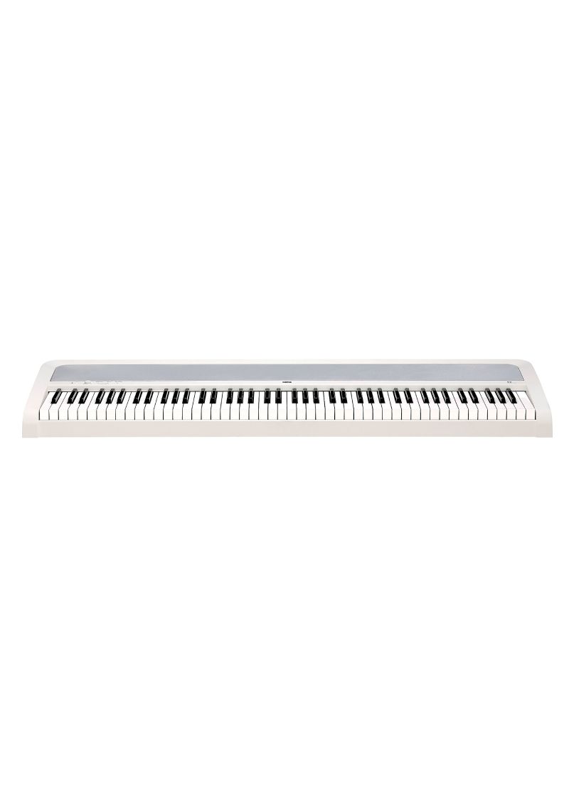korg b2 + 88 key digital piano Teclado de piano digital blanco sobre fondo blanco